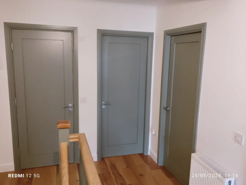 Three newly painted interior doors showcase handyman jobs in Dublin, with fresh paint and hardware.