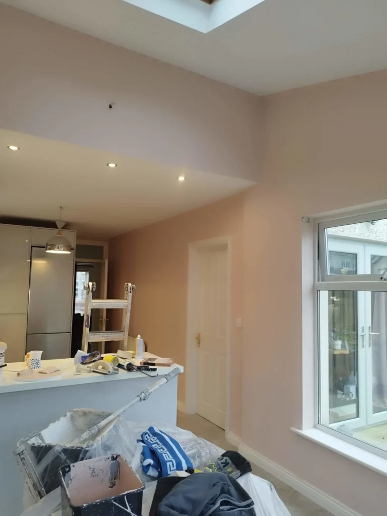 Interior view of a room during painting work; Your Handyman Dublin is doing wall repairs.