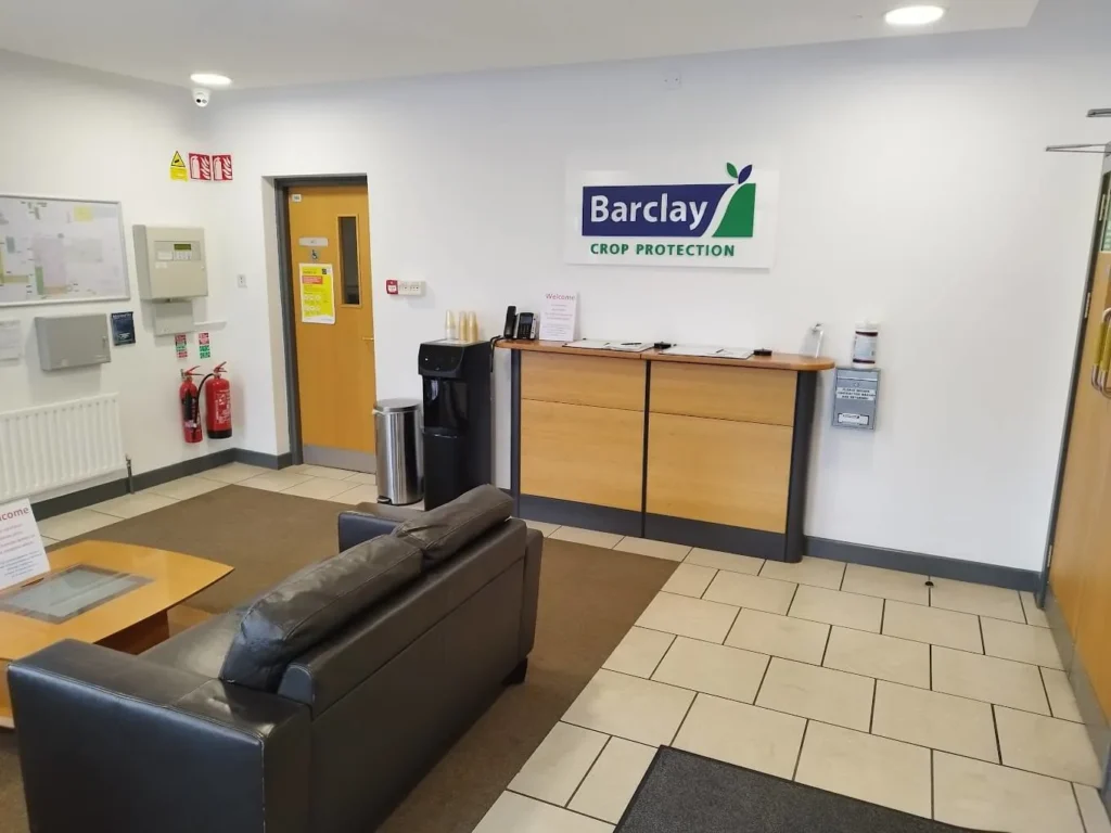 Barclay Crop Protection reception area with a welcome desk, seating, and company signage.