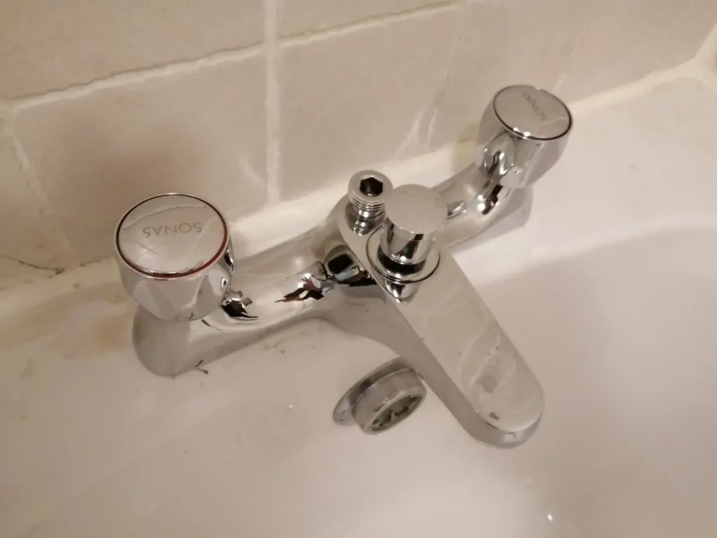 Chrome bathroom tap with detached handle. Services may include plumbing repairs for Dublin homes.