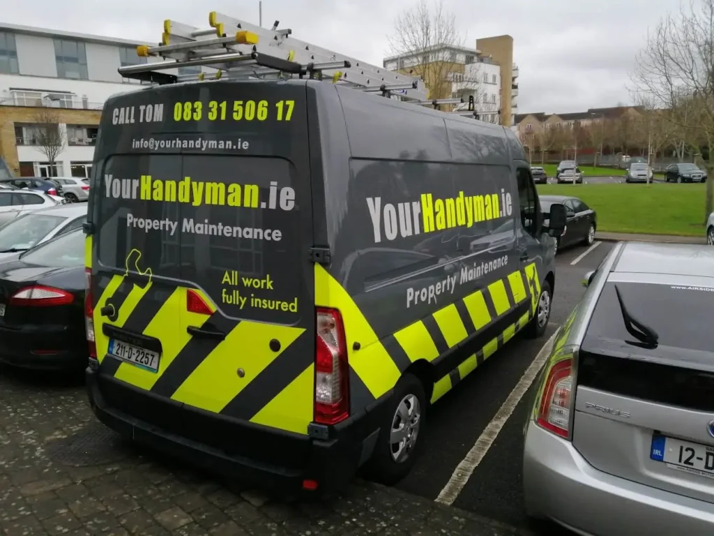 YourHandyman.ie van parked, advertising property maintenance and handyman services in Dublin with contact information.